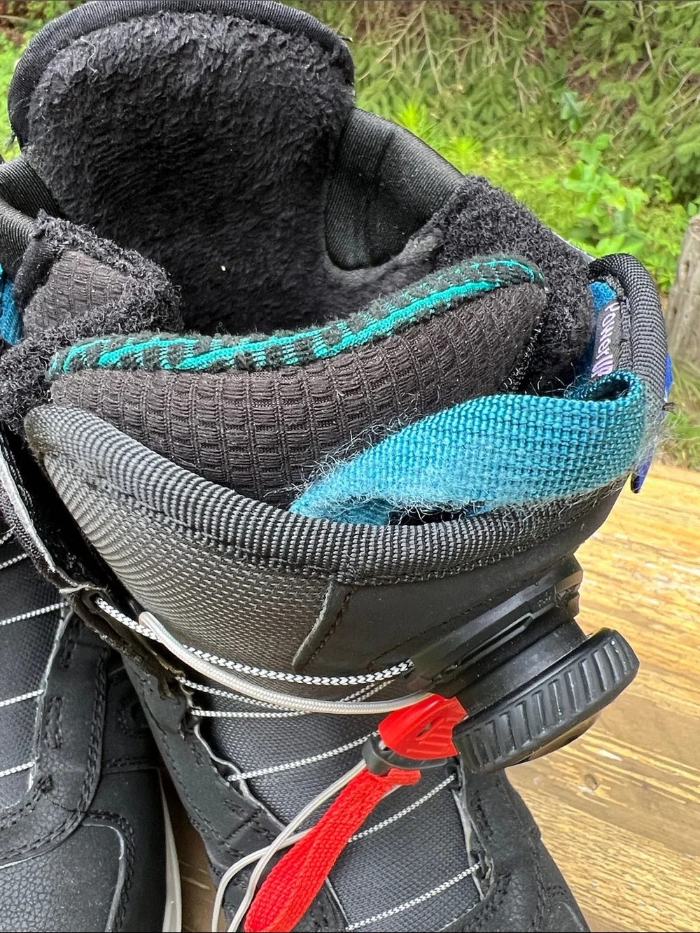 Burton Black Winter Boots with Teal Accents and Red Pull
